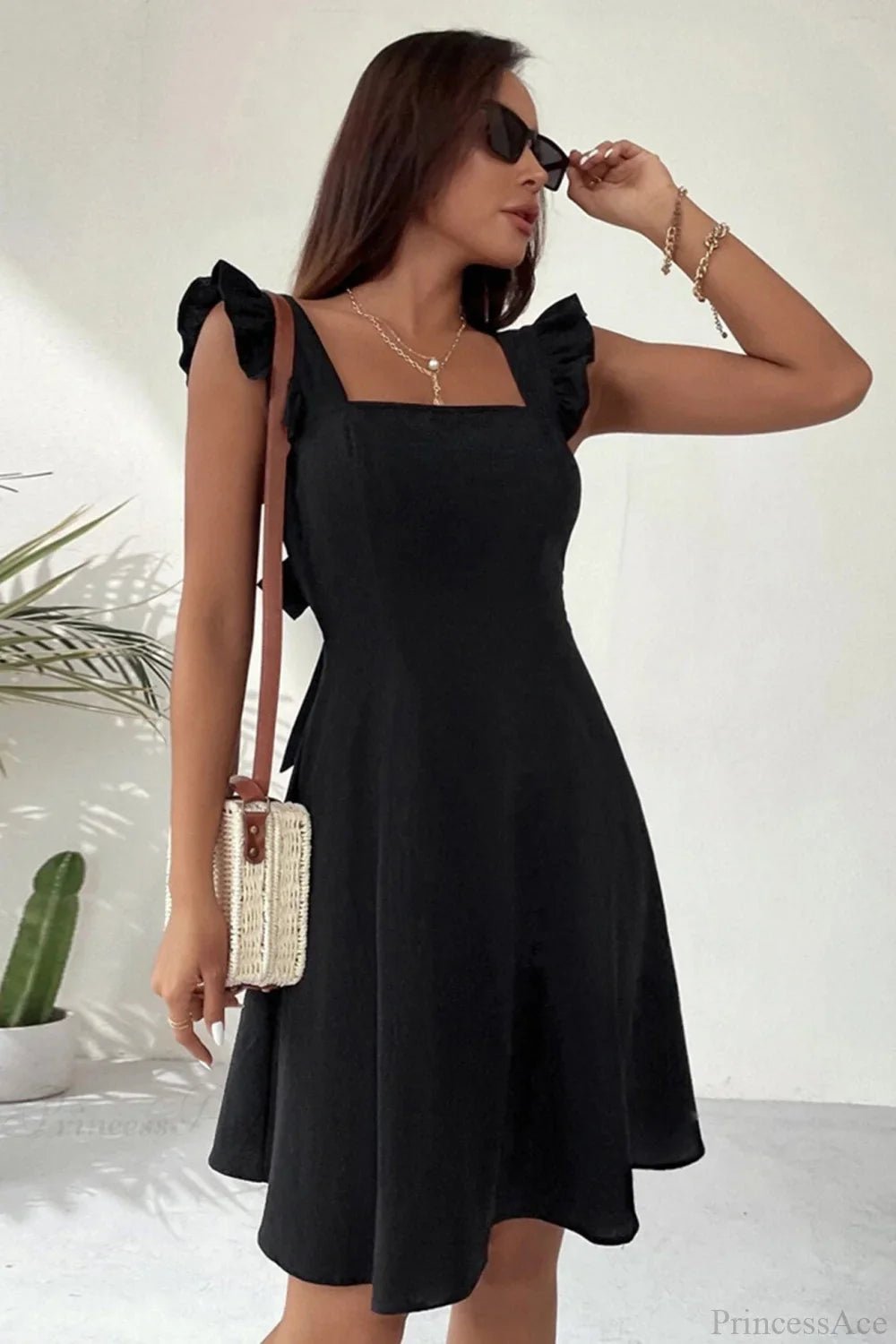 Carmen ärmelloses Minikleid mit Rüschenschleife am Rücken