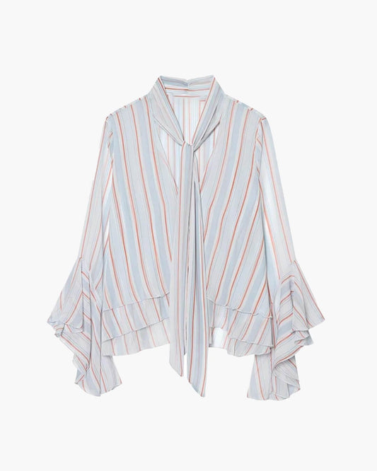<h2>Lucy Stripe Ruffle Tie-Neck Blouse für Frauen</h2>

<p>Die Schleife am Halsausschnitt ist nicht nur Dekoration. Sie ist das Detail, das einen einfachen Streifen in etwas Absichtliches verwandelt. Broadcloth-Polyester hält seine Struktur den ganzen Tag